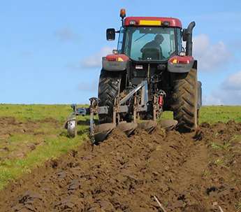 Tractor Tilling Land